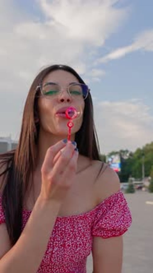 Portrait Happy Brunette Woman Wearing Glasses Blowing Soap Bubbles