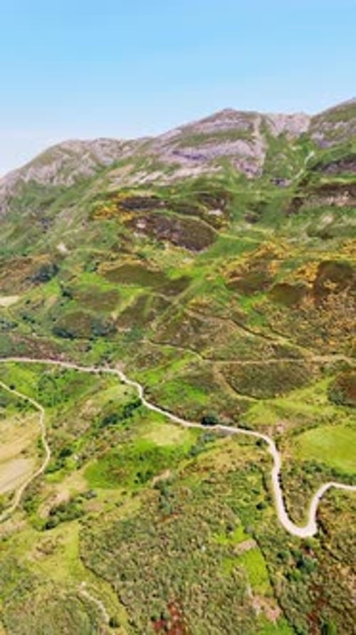 Stunning scenery of the sloping mountain crossed by the tourist trails and roads.