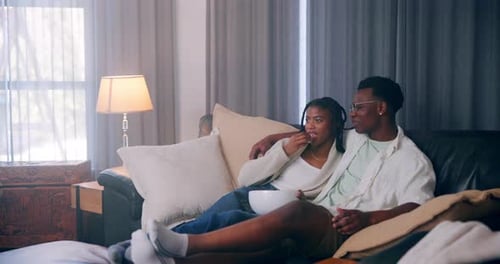 Couple Relaxing and Watching TV at Home