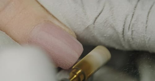 Closeup of Manicurist Remove Nail Gel Polish or Acrylic Using Manicure Machine