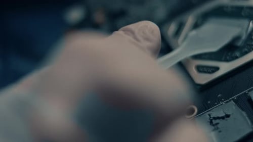 Applying Thermal Paste to Computer Processor Close Up