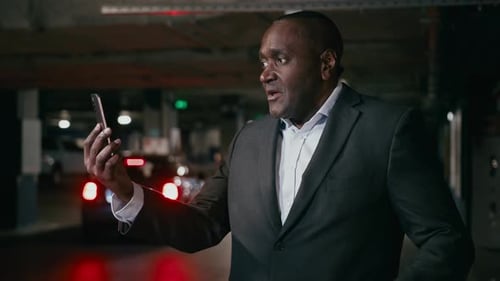 Adult Talking on Video Call in Parking Garage