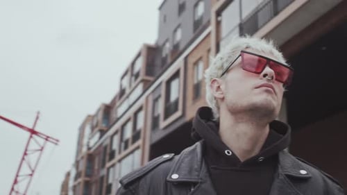 Stylish Teenage Young Guy with Colored Hair and Piercing Outdoor Portrait of Teenager Subculture and