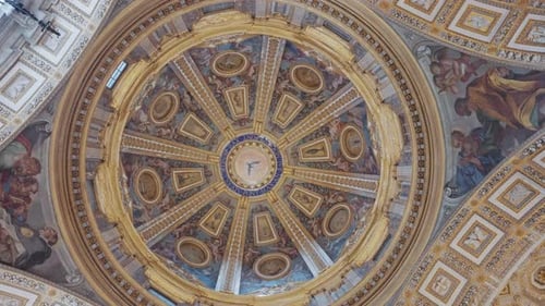 Stunning view spinning upward looking at the majestic dome and ornate ceiling of St. Peter’s