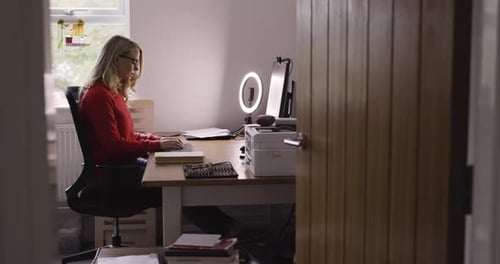 Computer, entrepreneur and woman remote working, typing and freelance in home office