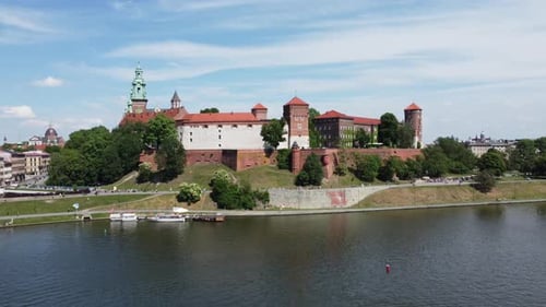Flyover of the Wawel Royal Castle on the Vistula (Wisła) River, City Centre - Krakow, Poland, a Poli