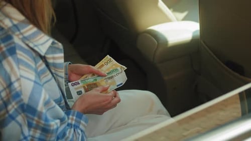 Payment in Taxi Businesswoman In Back Of Taxi Paying Fare Using Contactless Payment App On Mobile