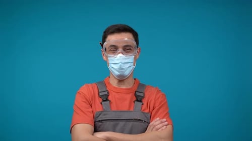 Man in Safety Gear and Mask Poses