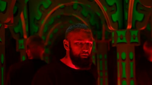 Hipster man dancing and listening to techno music at night club. Media. Interior of neon lighting