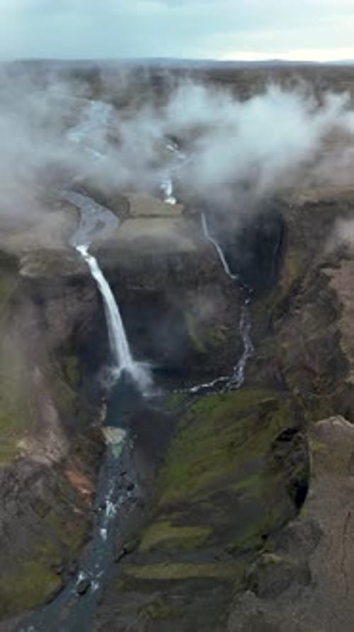 Majestic Waterfall Cascading Through a Gorge from Above