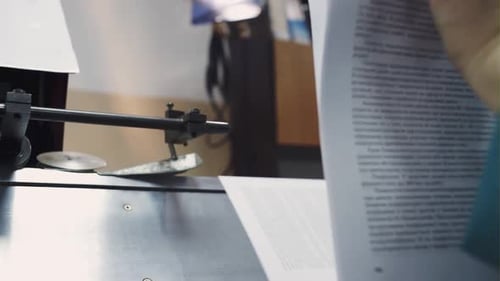 Hand Near the Old Machine That Sews Books Printing