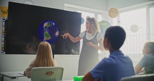 Elementary School Teacher Giving Solar System Lesson