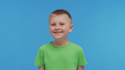 Portrait of Happy Smiling Boy in Tshirt Attractive and Expressive Kid in Studio