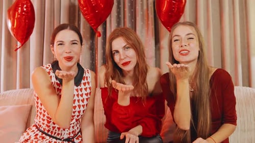 Three Women Celebrating Friendship with Kisses and Hearts