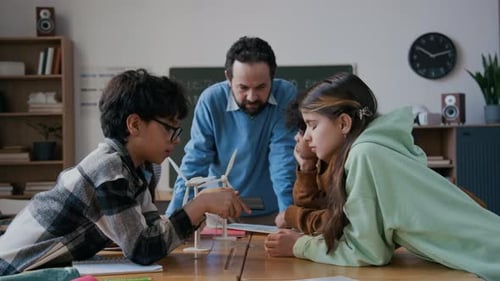 Students Study Renewable Energy with Teacher in Classroom
