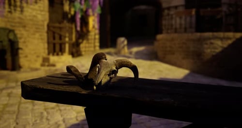 Ram Skull Displayed on Wooden Table in Ancient Alleyway During Twilight