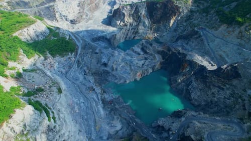 Aerial view flying over a quarry in the tropical