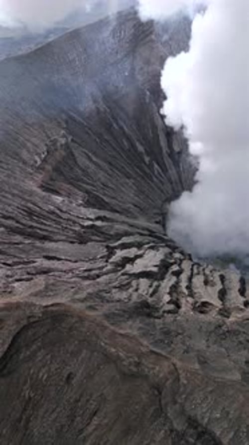 Aerial View of Steaming Mount Bromo Volcanic Crater in East Java Indonesia