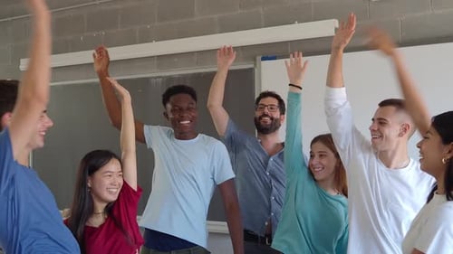 Students and Teacher Cheering in a Classroom