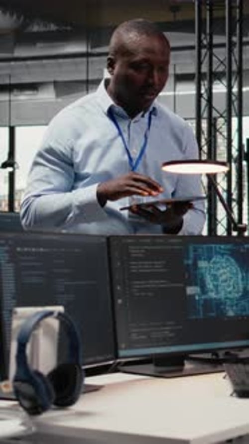 Vertical Video Manager Talking with Engineer in Office Automating Workflows Using AI