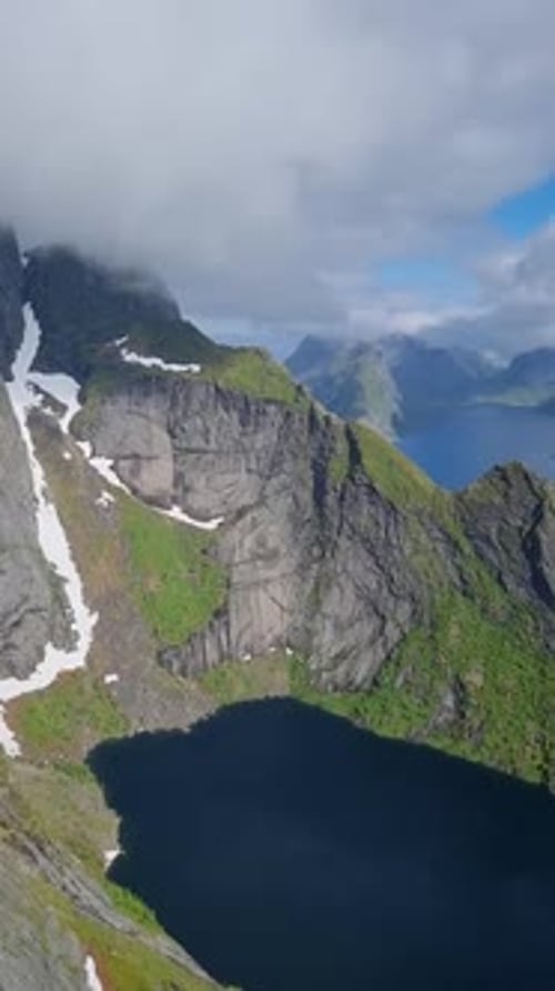 Discover the Stunning Beauty of Norway'majestic Mountains and Cascading Waterfalls Lofoten