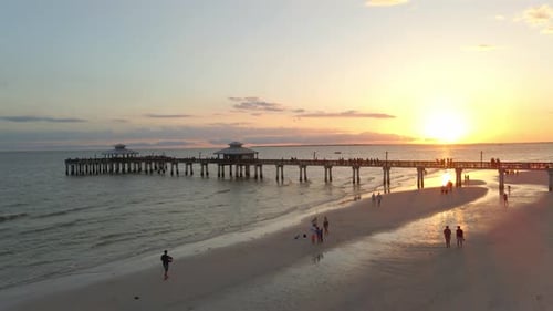 People watching the sunset on vacation in a beautiful beach in Fort Myers Florida