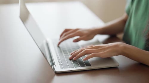 Woman Typing on Laptop Computer Keyboard