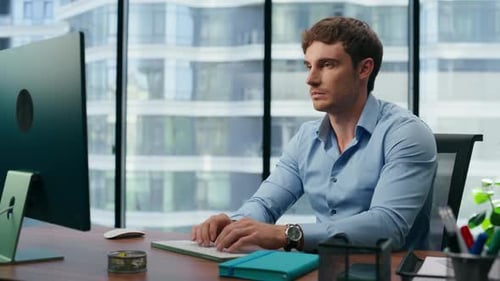 Focused Businessman Working Computer in Office. Pensive Professional Looking Charts Pc Screen