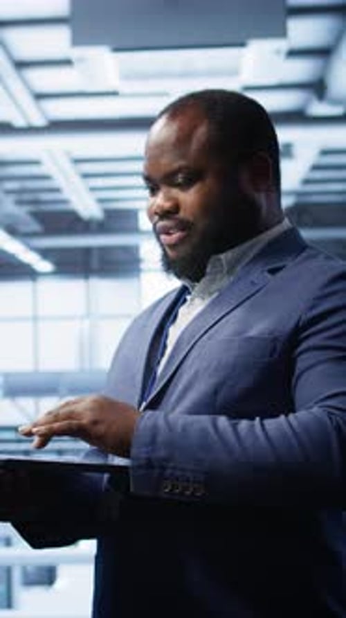 Vertical Video IT Professional in Server Room Looking for Network Issues