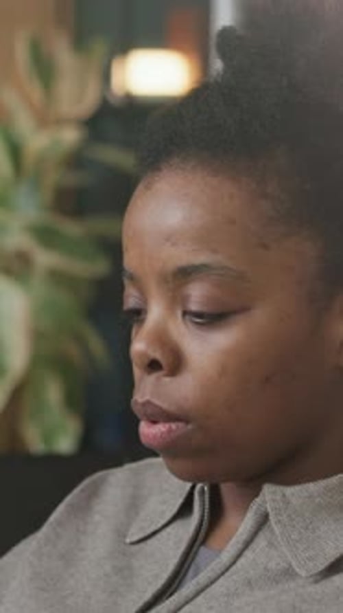 Vertical of Concentrated Black Female Software Engineer Working in Office