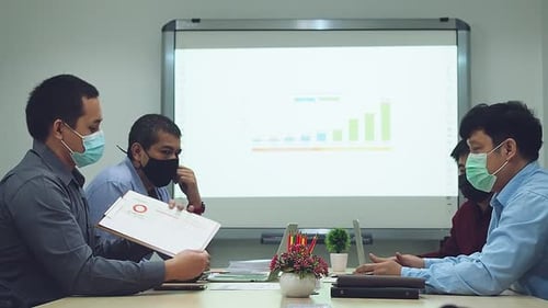 Coworkers Meeting Wearing Masks During Pandemic