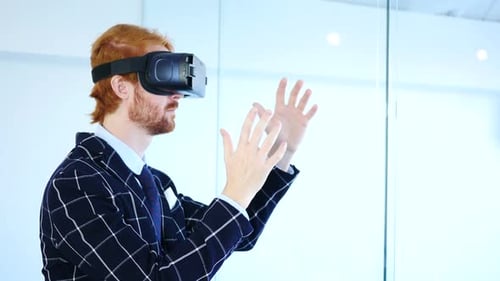Man Using Virtual Reality Headset in Office