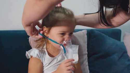 Young Girl Receives Nebulizer Treatment at Home