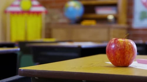 Still Life of Apple at School Desk