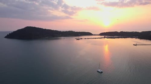 A Scenic Sunset Above A Tranquil Sea
