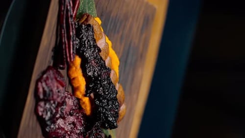 close-up of a dish pieces of juicy roasted duck with puree on a plate Asian cuisine restaurant