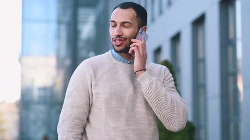 Smiling Man Talking on the Phone Outdoors