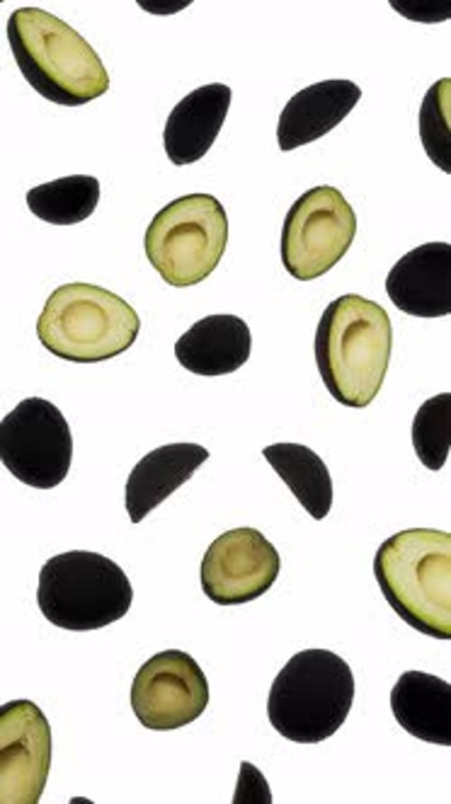 Floating Halved and Whole Avocados Animated Background Loop