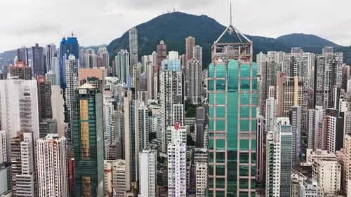 A large city filled with tall buildings under a cloudy sky