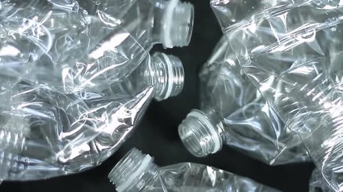 recycled plastic bottles on a table keeping the environment green no people stock footage