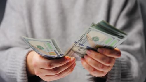 Counting Stacks of United States Currency Close Up