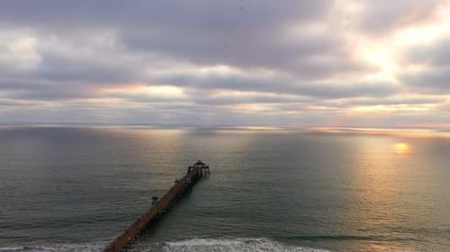 Arrow Like Shape Of Imperial Beach Pier With Seafood Restaurant On The End During Sunset. - aerial