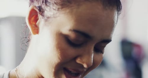 4k footage of a woman looking exhausted after her workout at the gym