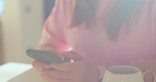 Woman Holding Smart Phone Indoors, Close Up