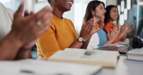 Diverse Group of Adults Applauding at Desk