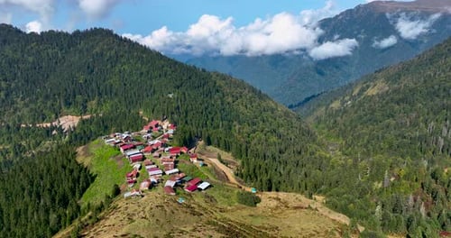 Aerial View of Rural Village in Mountainous Landscape
