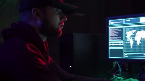 Man in Dark Room Working on Computer