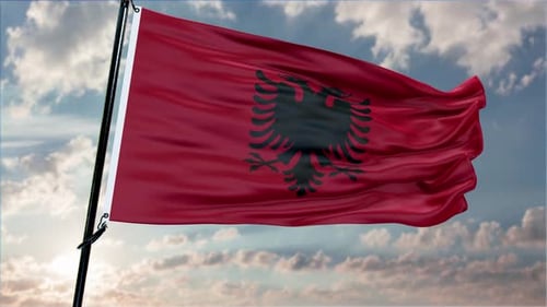 Albanian Flag Waving on a Cloudy Sky Loop