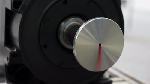 Silver Disk Rotating on Black Machine