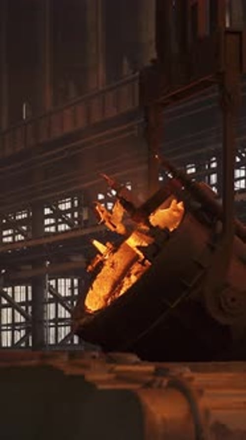 Molten Metal Pouring From a Giant Ladle in a Steel Mill Stock Clip